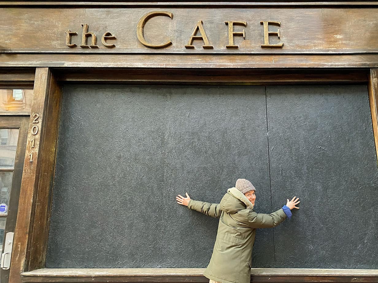 Jack standing outside the fake Cafe Ribbit cafe
